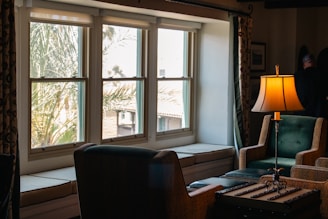 A living room filled with furniture and a lamp