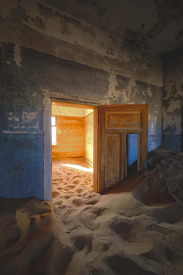 Sand-filled corridor in Kolmanskop hospital