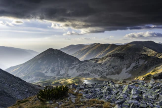 A view of a mountain range with a cloudy sky