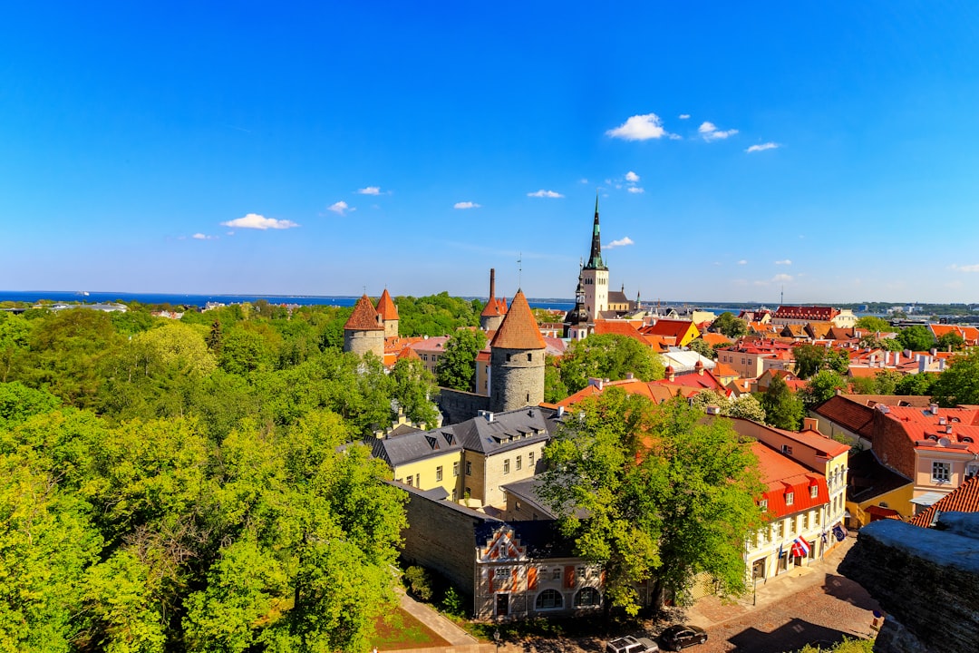 An aerial view of a city with a church tower
