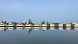 A body of water filled with lots of houses