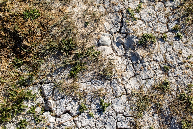 An aerial view of a rocky area with grass and rocks