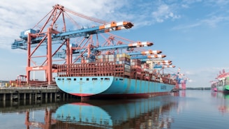 A large blue boat sitting in the water