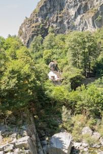 A mountain with a house in the middle of it