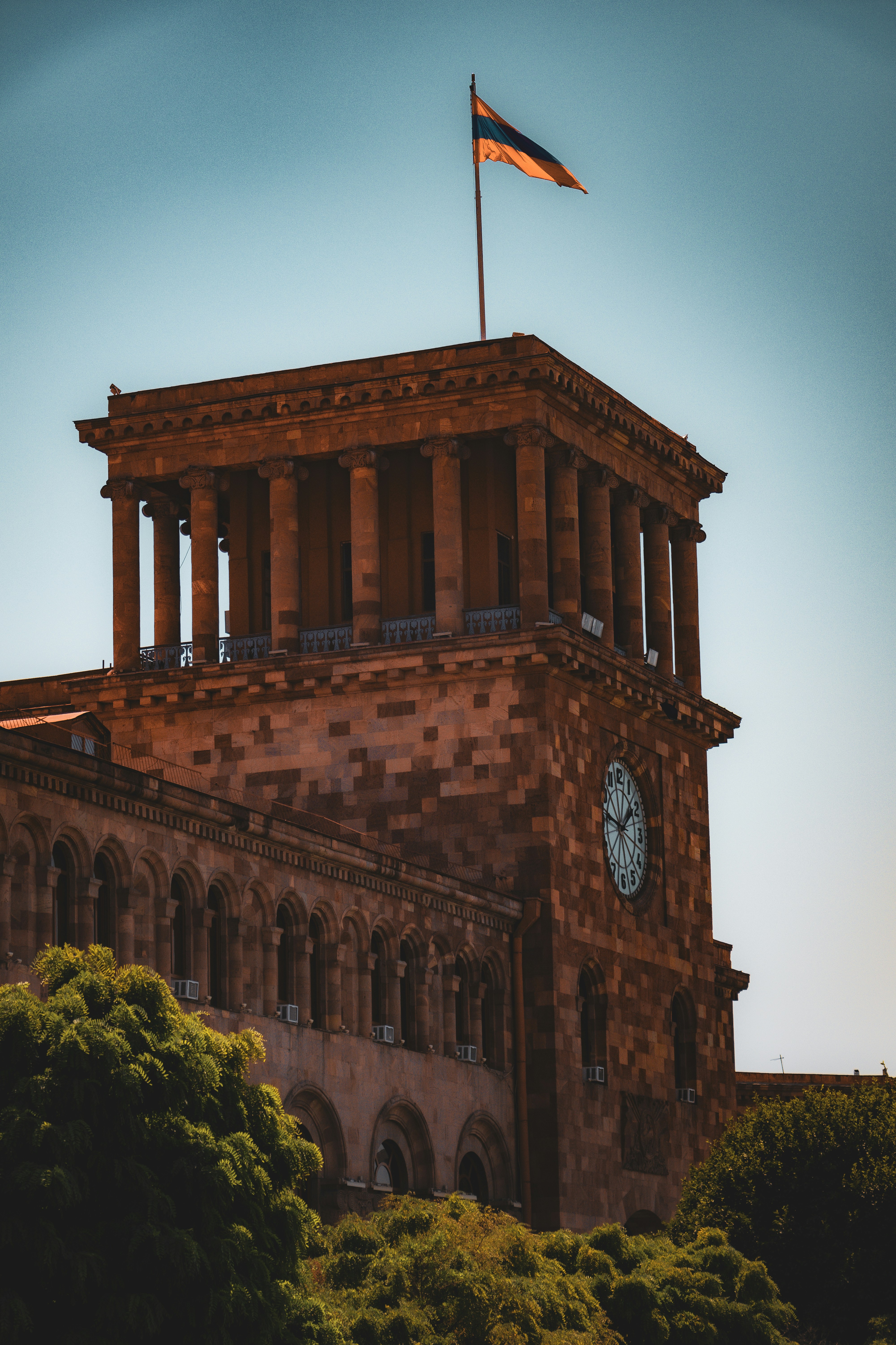 A tall building with a clock on the top of it