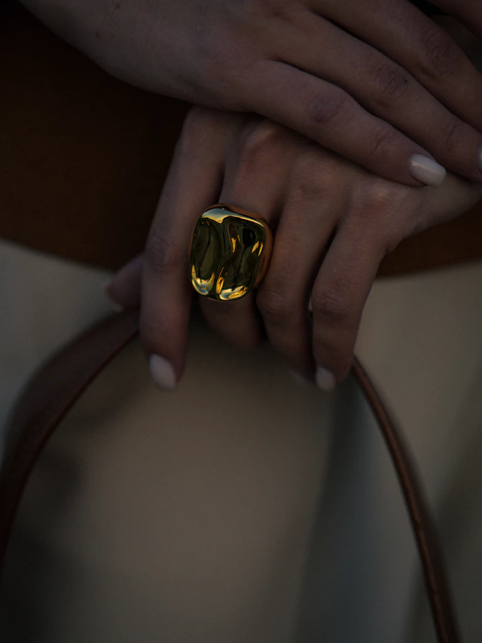 Artisan jeweler hand-finishing a gold piece — slow craftsmanship at Maison Soléne