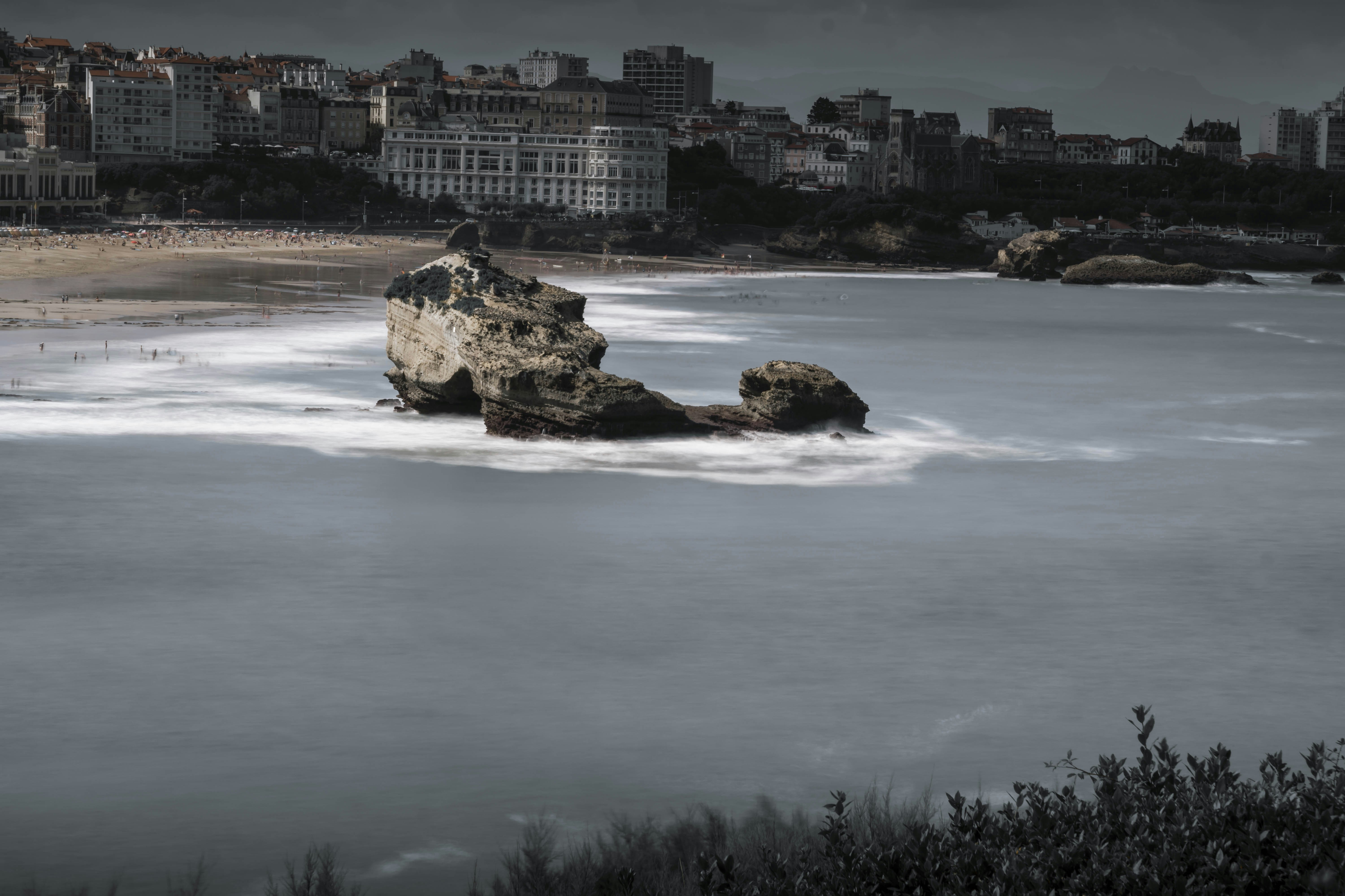 A large body of water with a city in the background