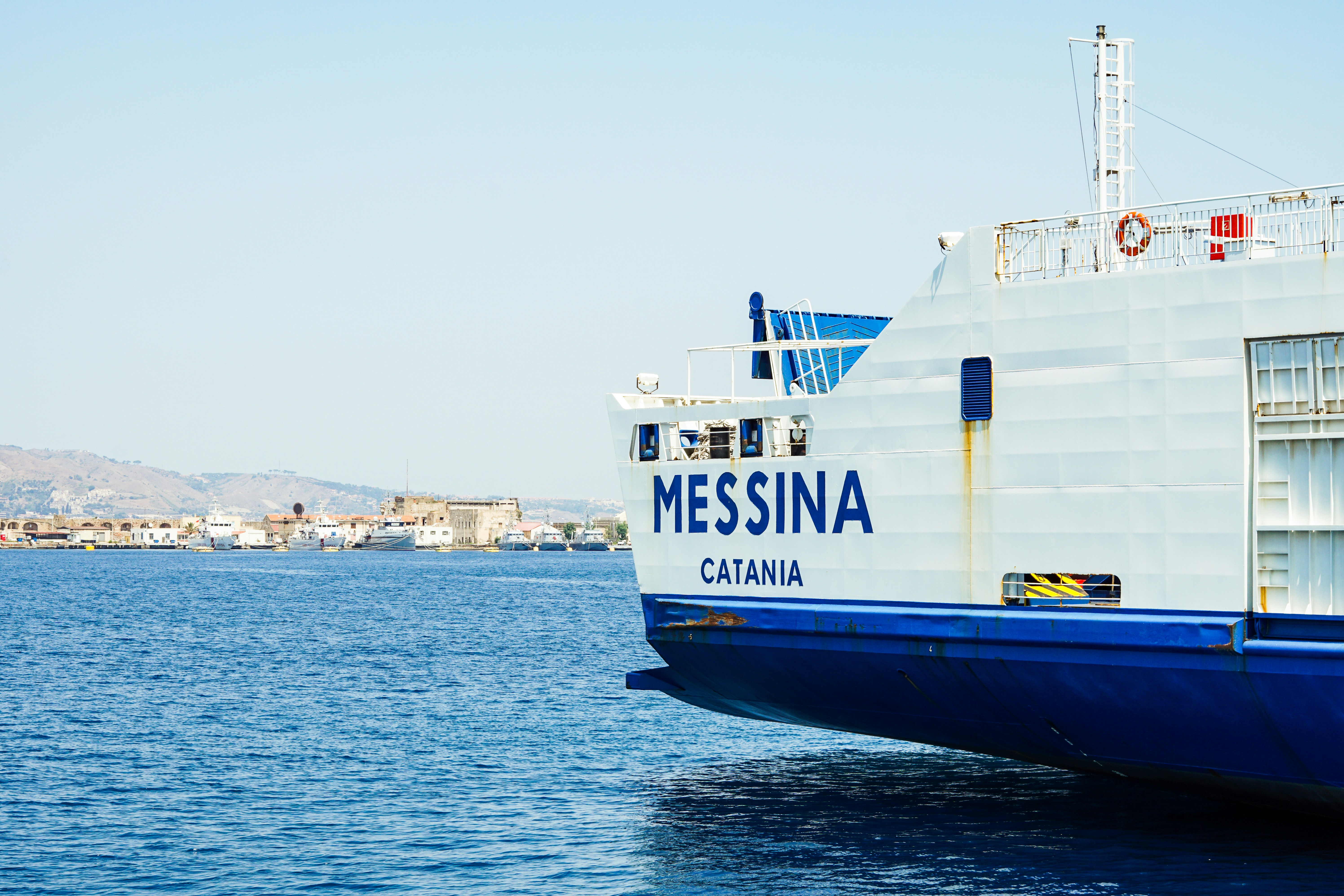 A large boat floating on top of a body of water