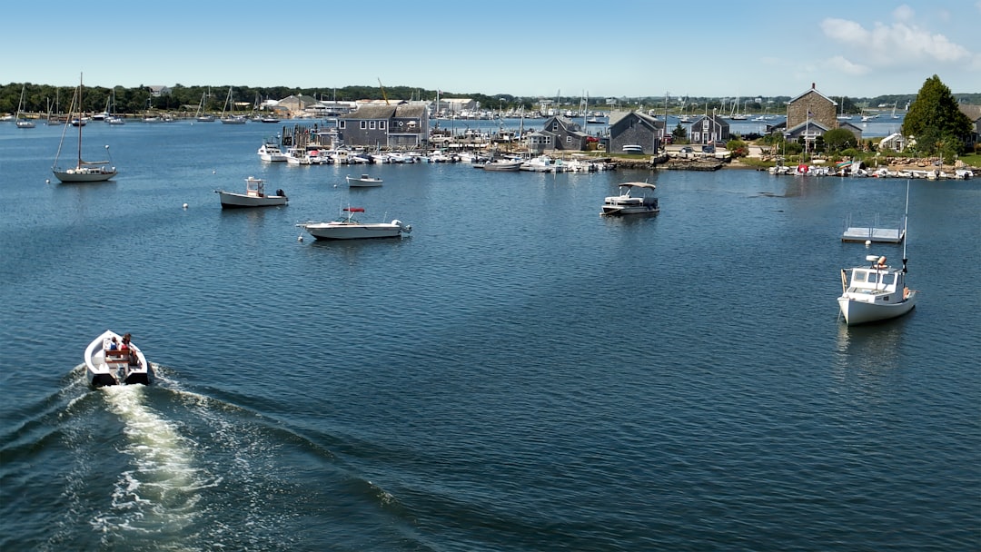 A group of boats floating on top of a large body of water