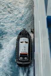 A harbor pilot boarding a ship