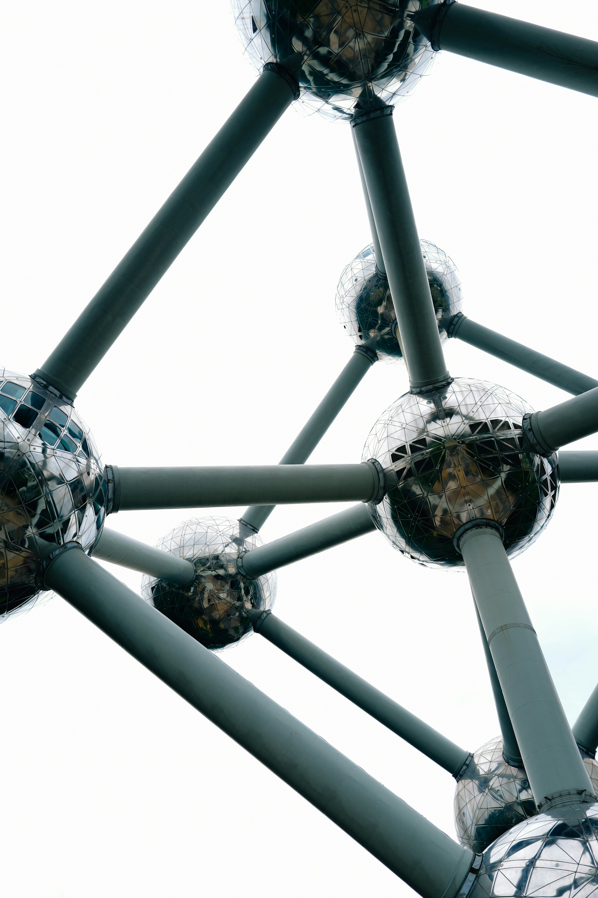 A close up of a metal structure with balls on it