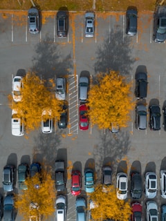 A parking lot filled with lots of parked cars