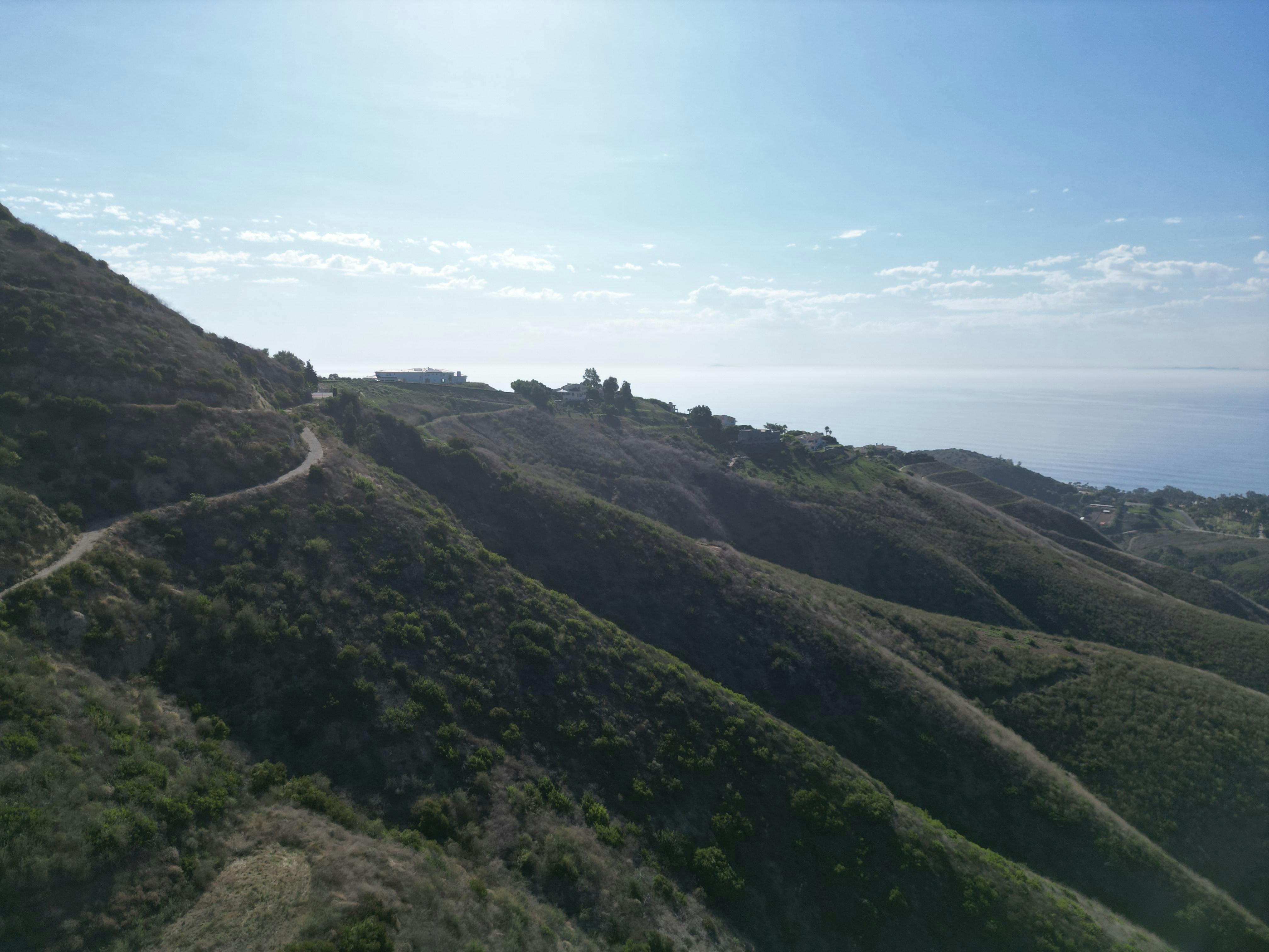 A view of a road going up a hill, 