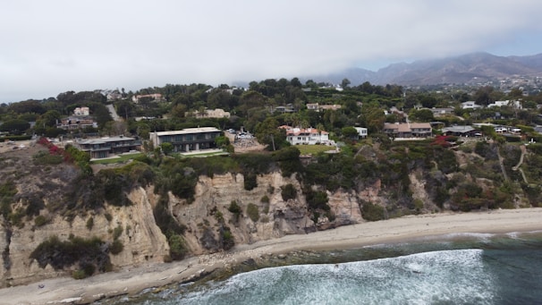 A bird's eye view of a beach with houses on it