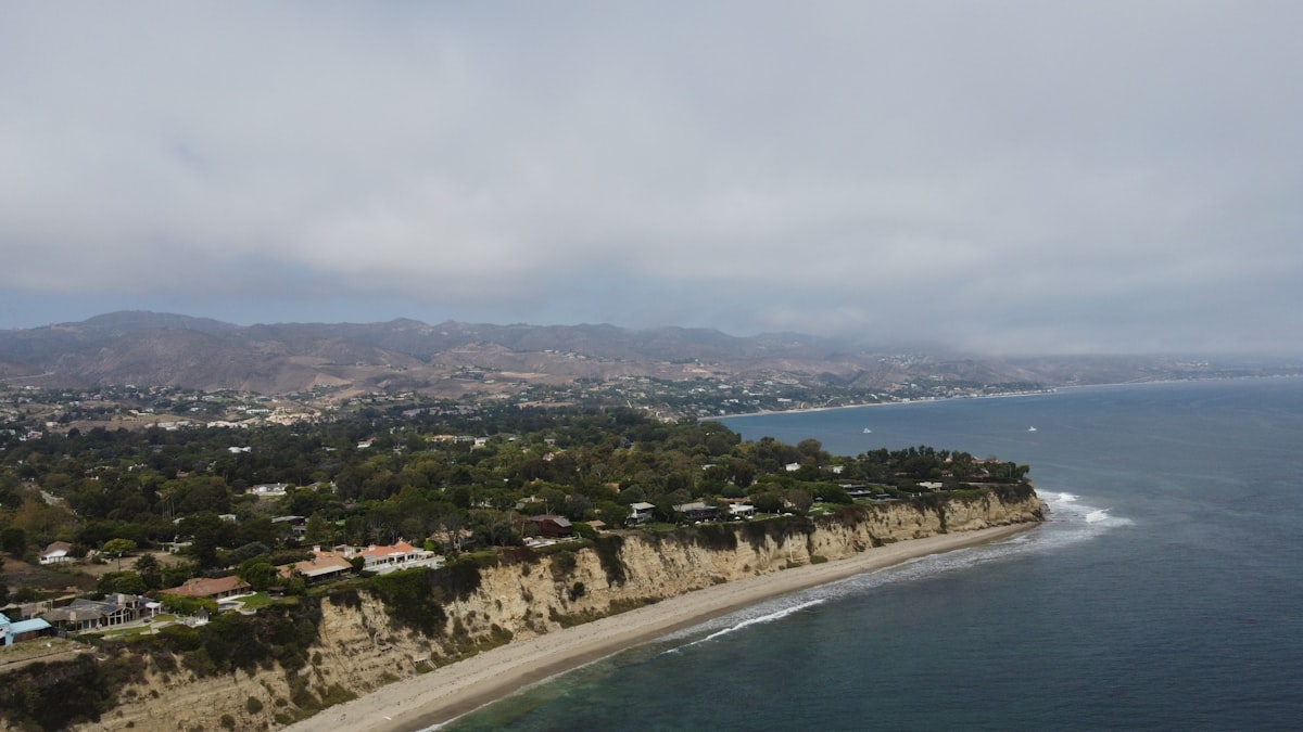 Aerial photograph of a California coastal bluff with ocean and cliffs visible