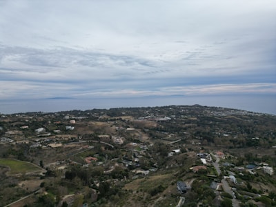 A bird's eye view of a small town on a hill