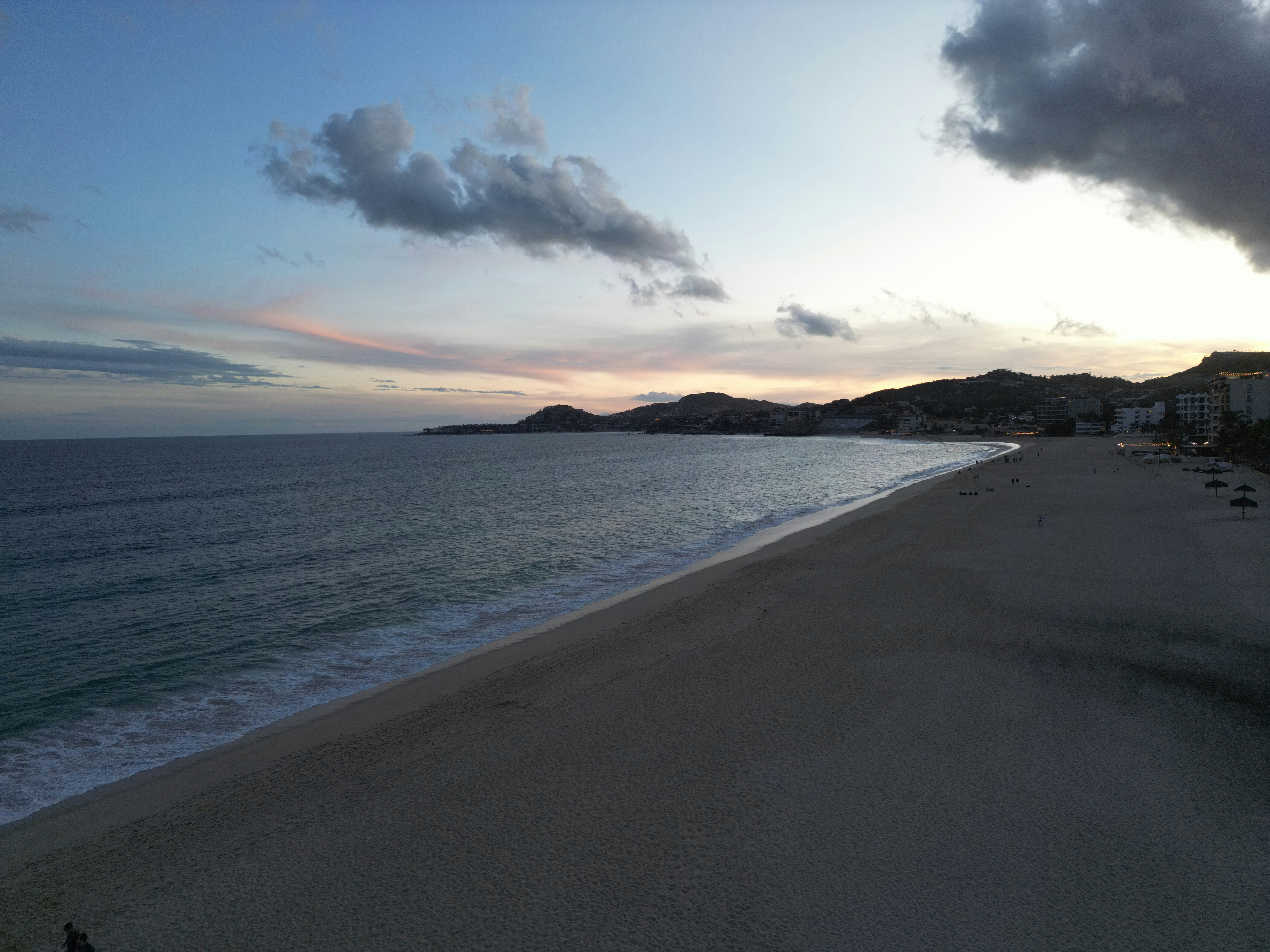 Family enjoying a sunset on the beach in Cabo San Lucas