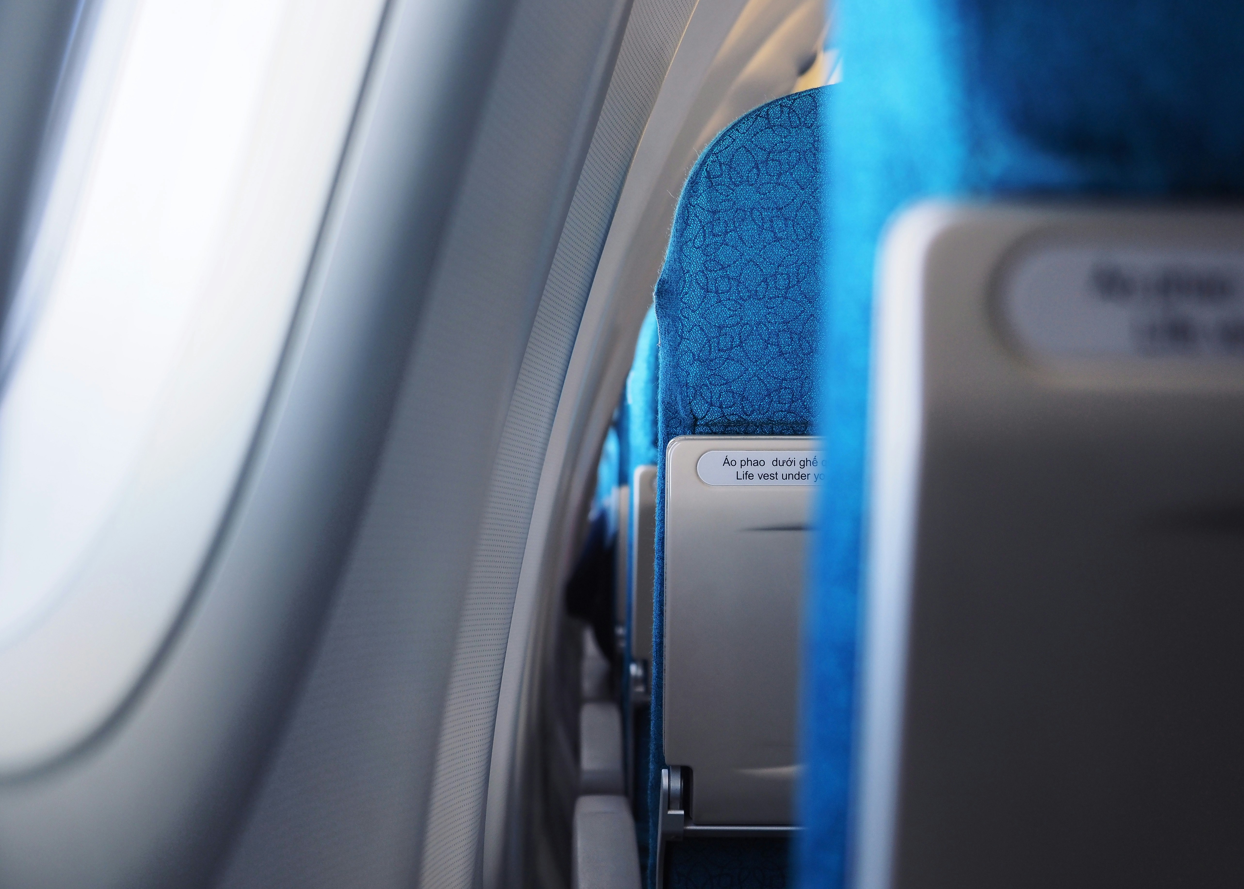 A view of the inside of an airplane looking out the window, Vietnam Airlines seats, airbus A321, flight time.