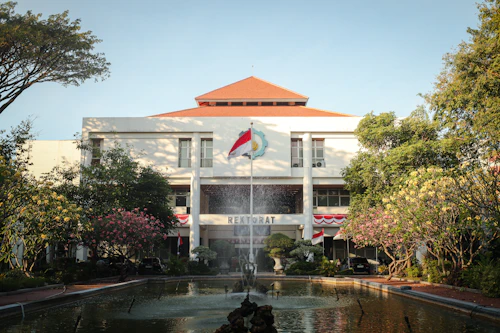 Indonesian university campus building with fountain