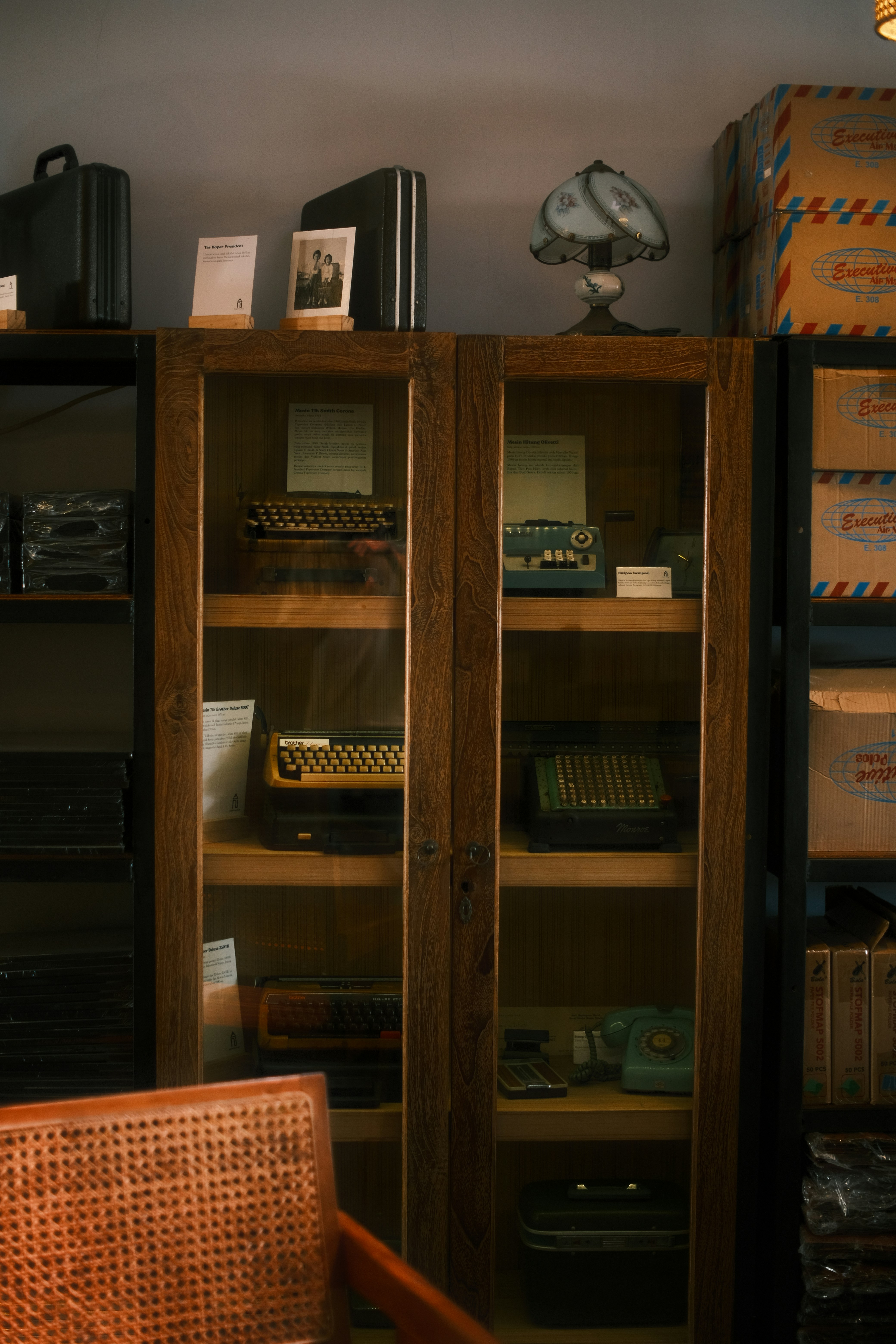 A room with a book case and a chair