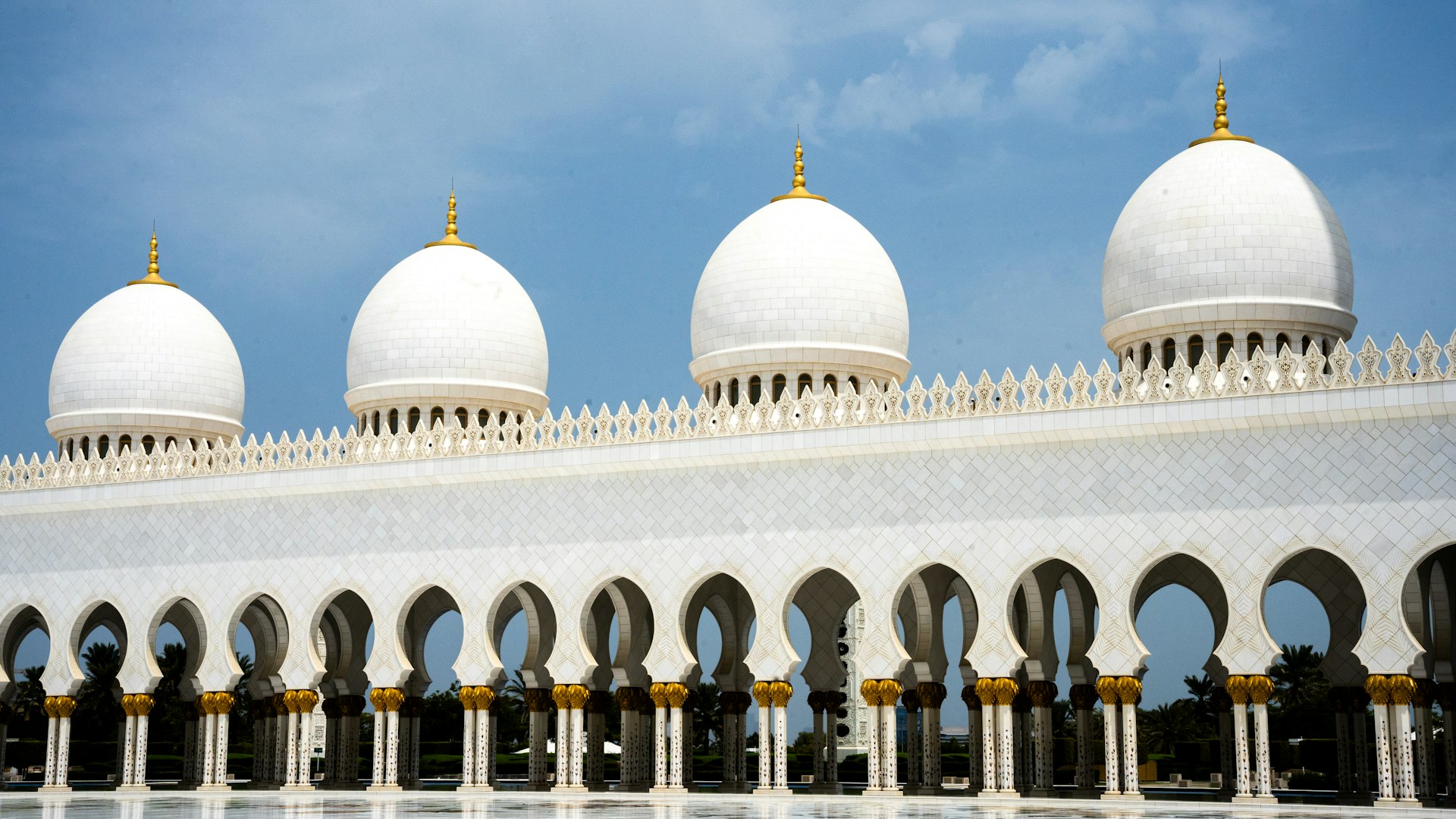 A large white building with arches and domes