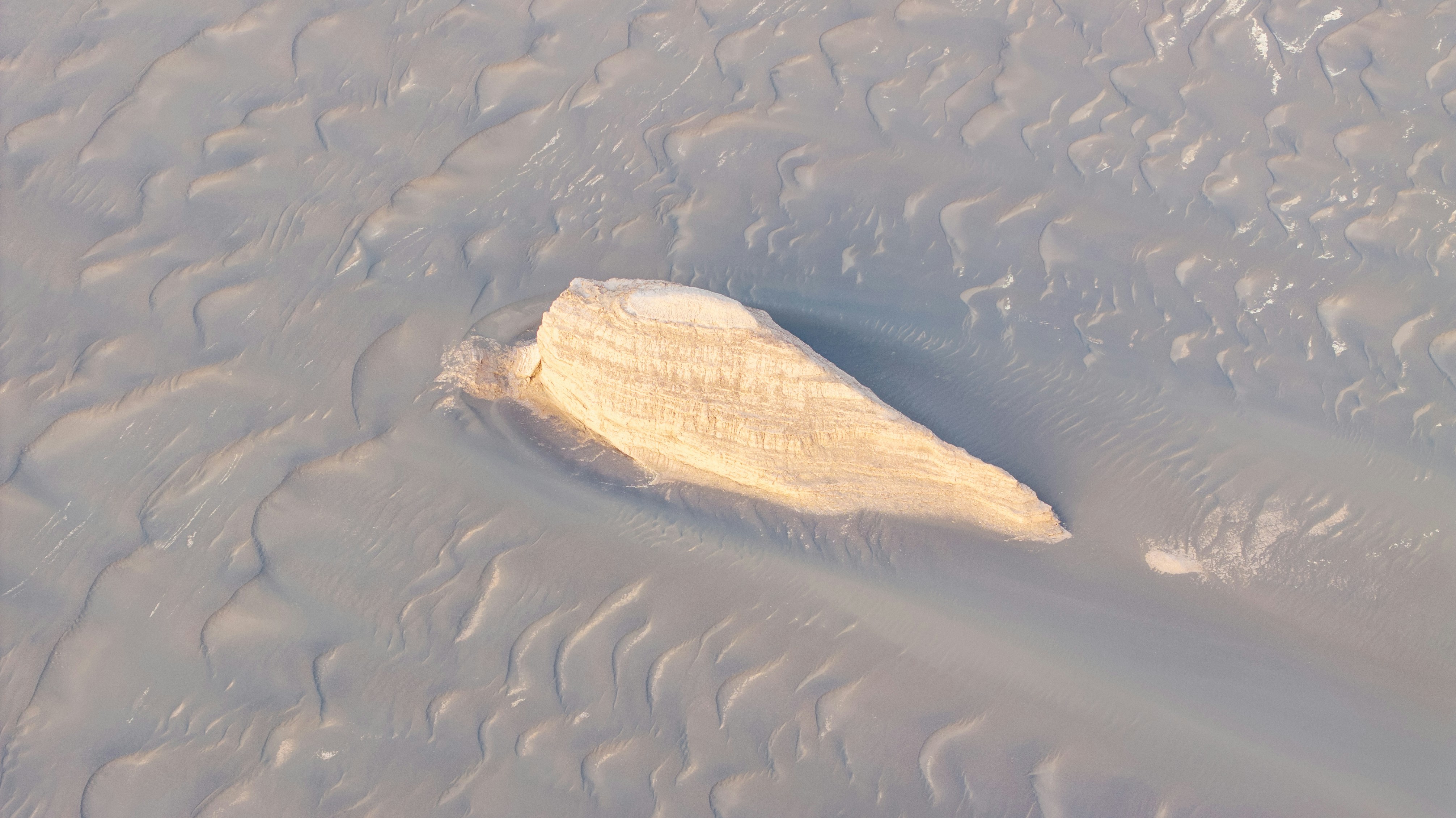 A large white object floating on top of a body of water