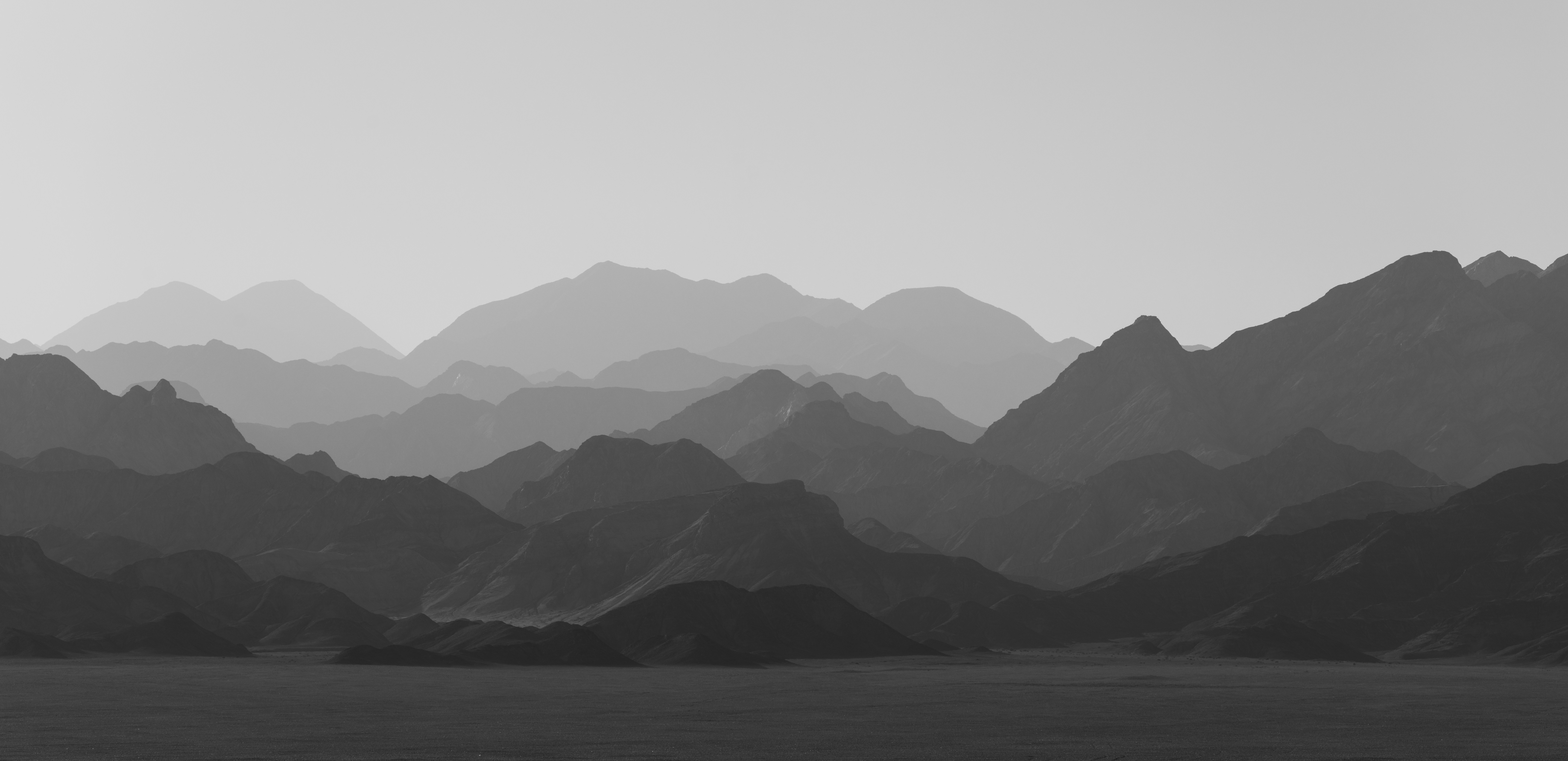 A black and white photo of a mountain range