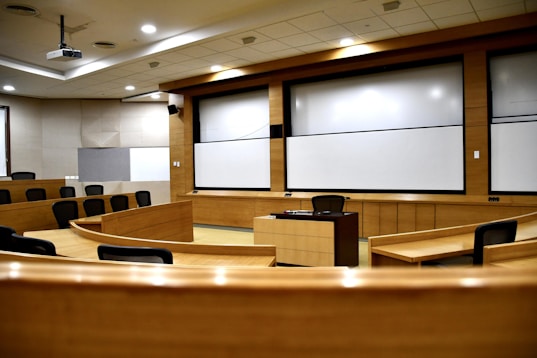 An empty conference room with a projector screen