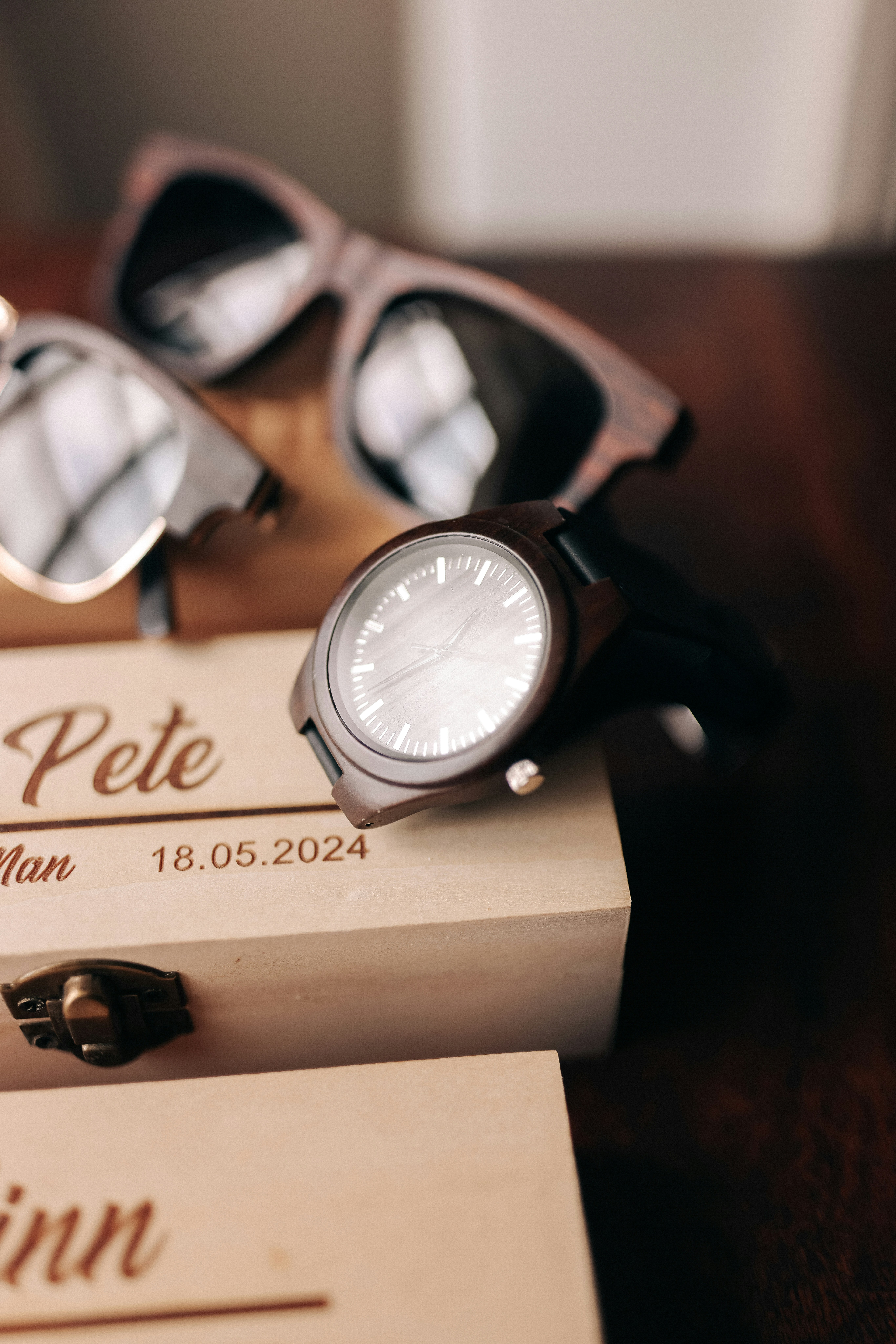 A couple of sunglasses sitting on top of a wooden box