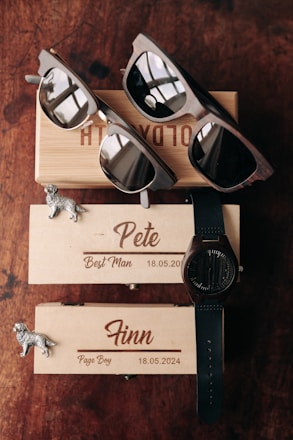 A couple of sunglasses sitting on top of a wooden box
