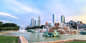 A large fountain in the middle of a park