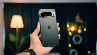 A person holding a cell phone in their hand