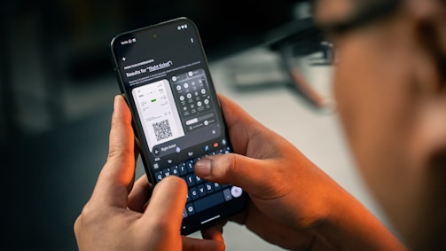 A man holding a smart phone in his hand