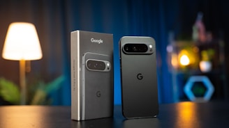 Two cell phones sitting next to each other on a table