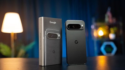 Two cell phones sitting next to each other on a table