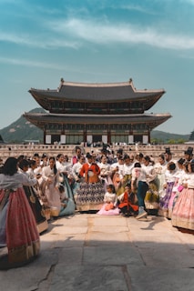 A group of people standing in front of a building