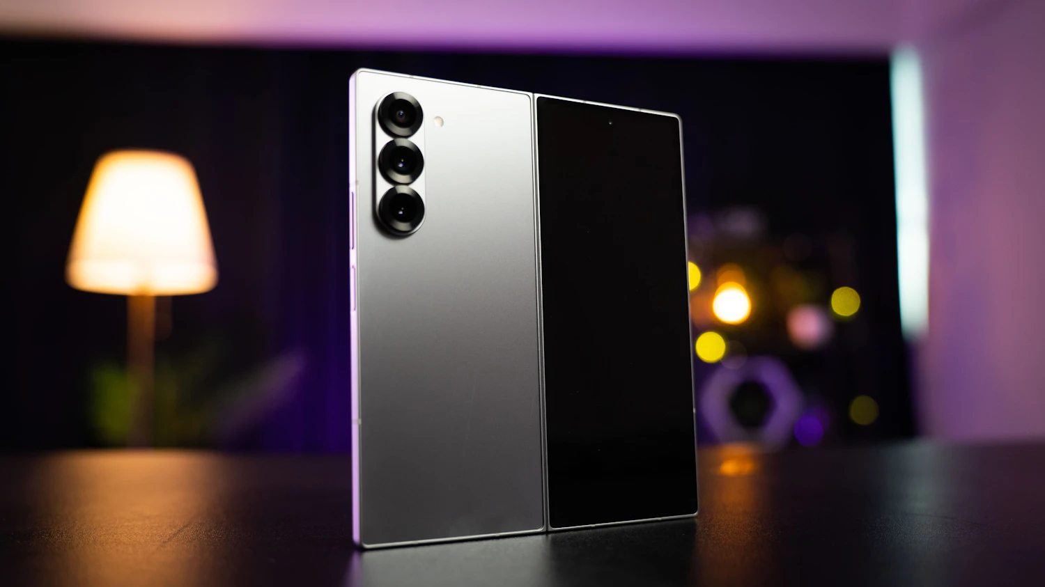 Lumo Fold 3 standing half open on a dark table, the phone the Hinge Guard Case is cut for
