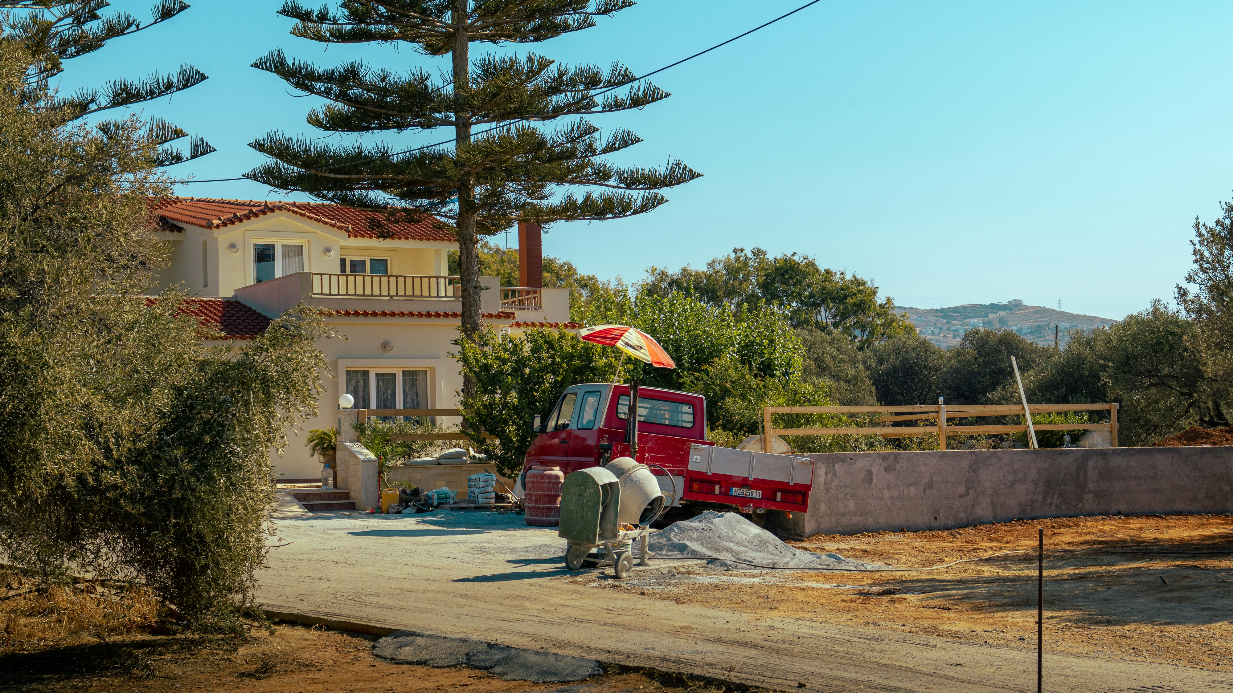 A red truck parked in front of a house