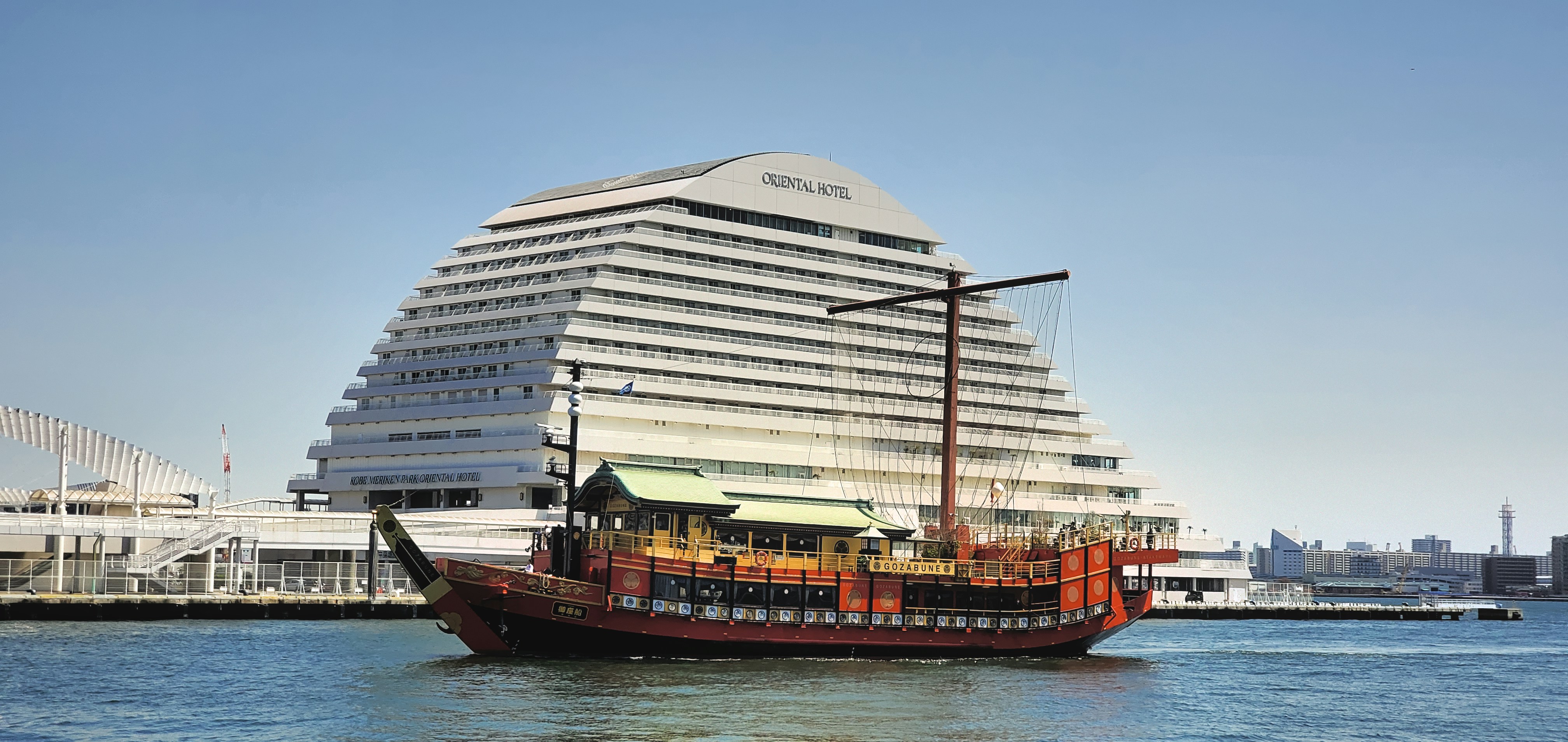 A large boat floating on top of a body of water