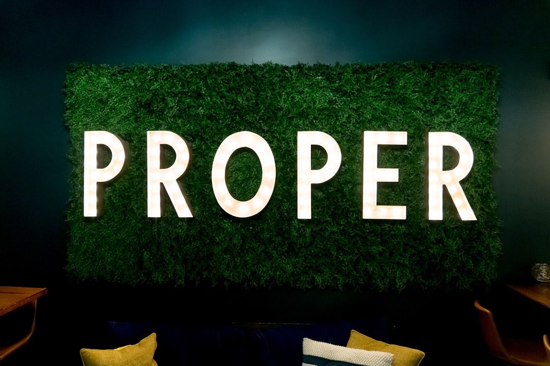 A room with a green wall and a sign that says proper,