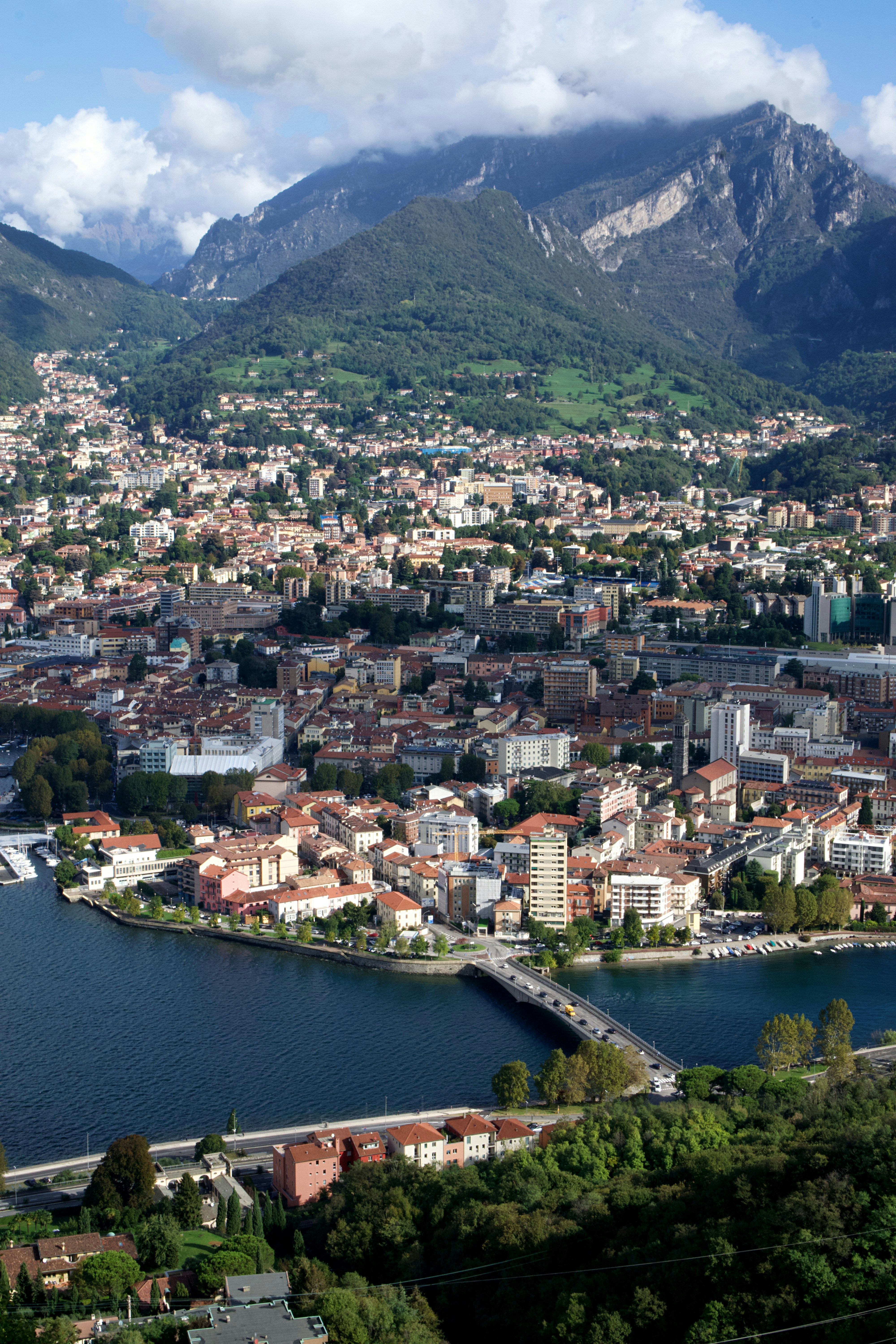 An aerial view of a city with mountains in the background