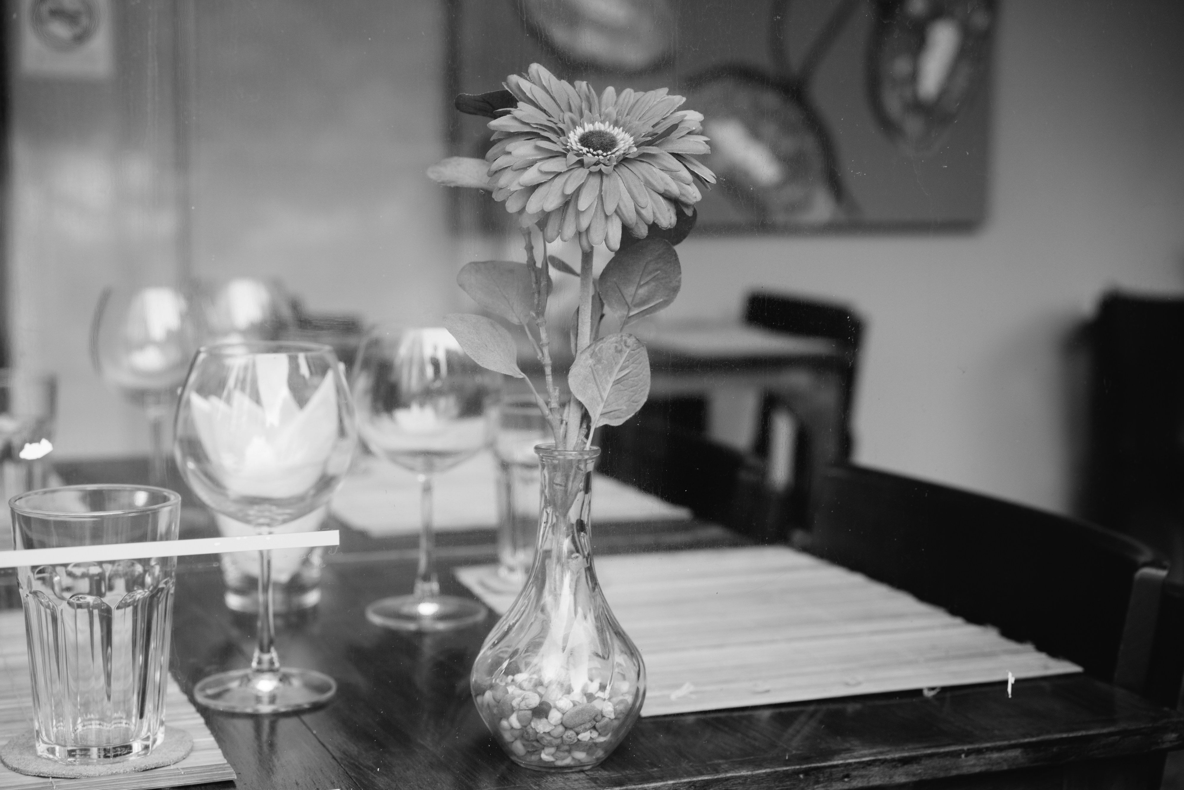 A black and white photo of a dining room table