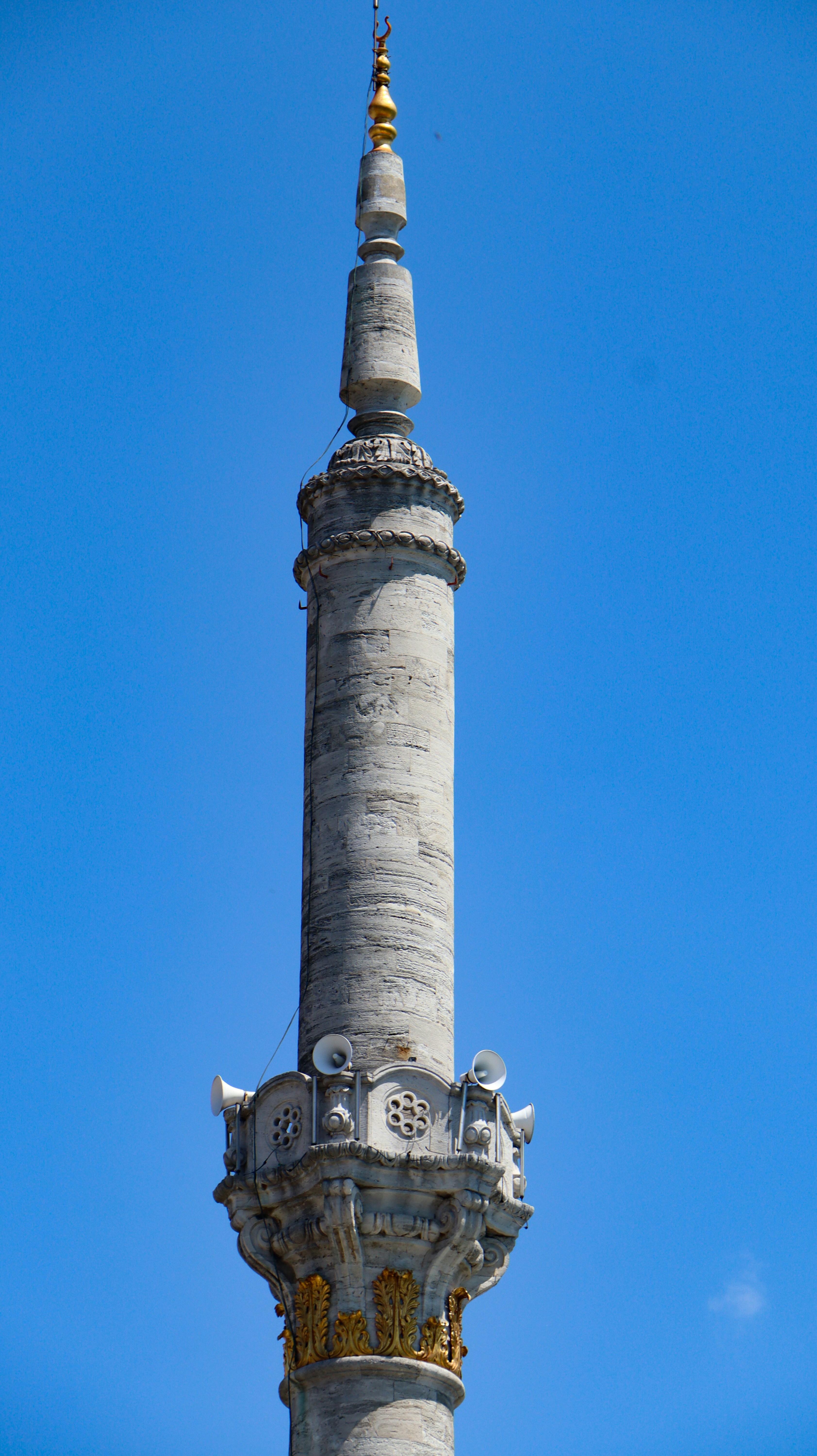 A tall tower with a clock on it's side