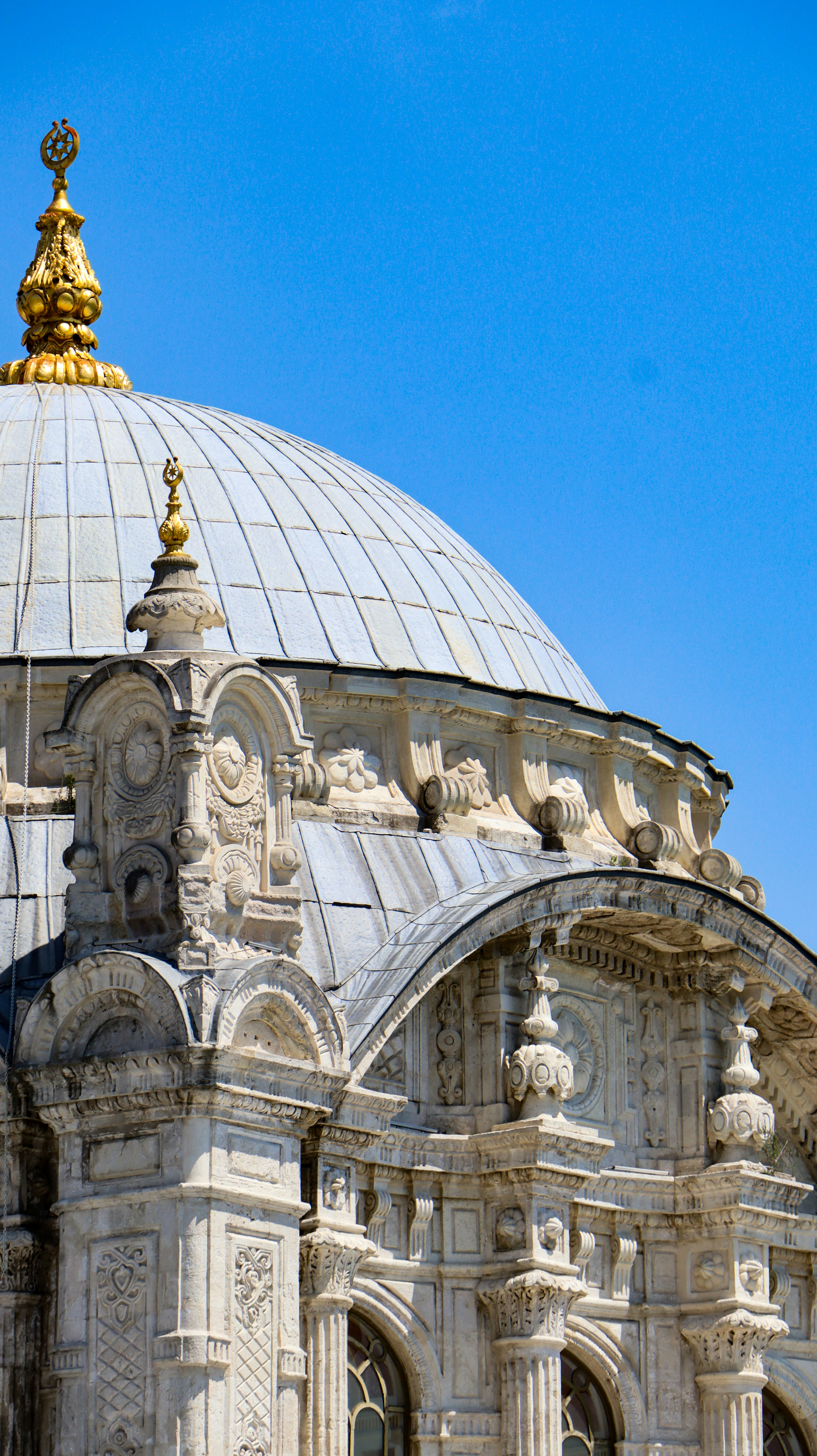 A large white building with a gold dome