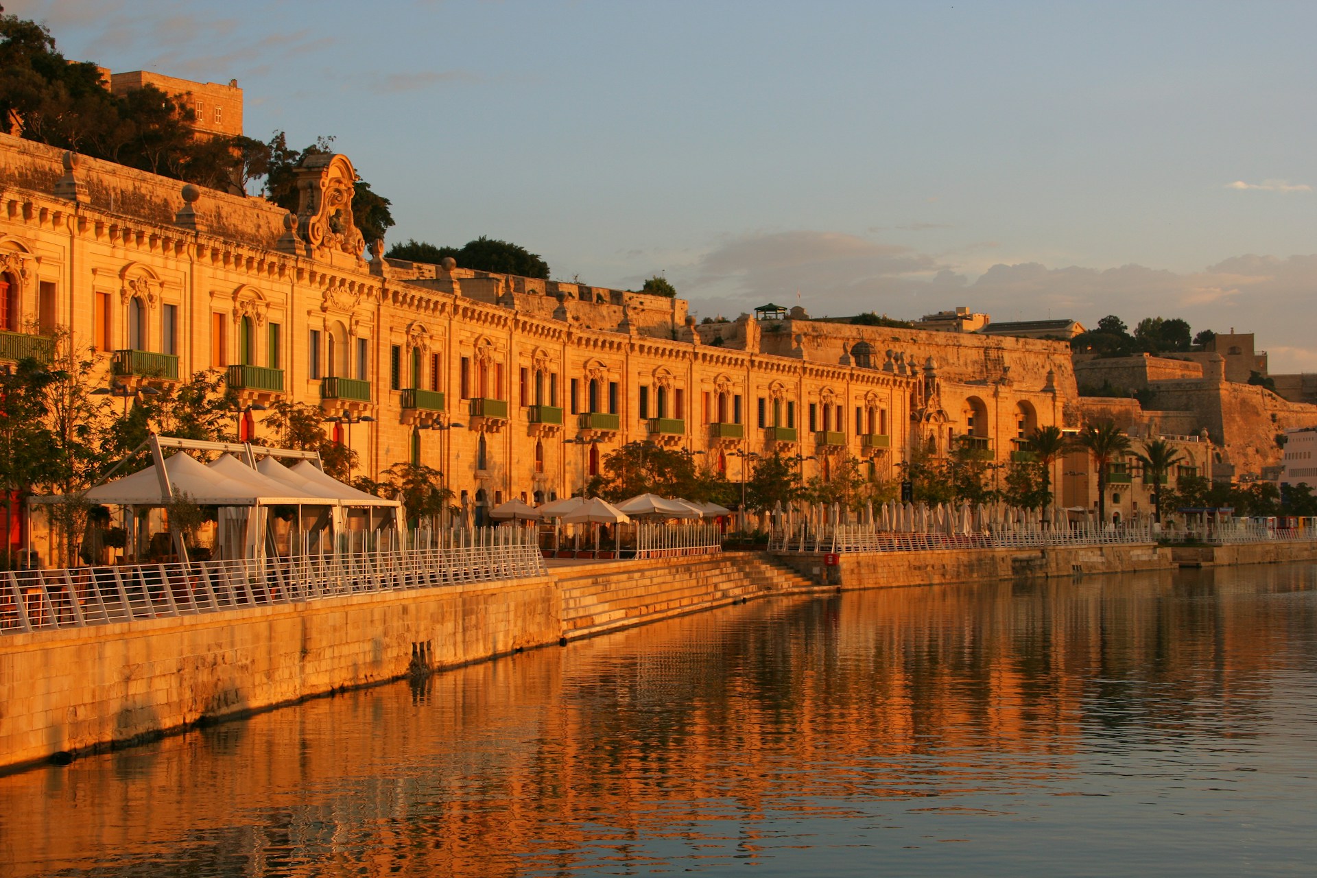A large building sitting next to a body of water