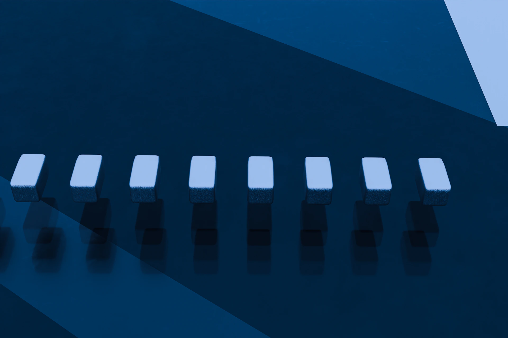 A close up of a metal object with a blue background