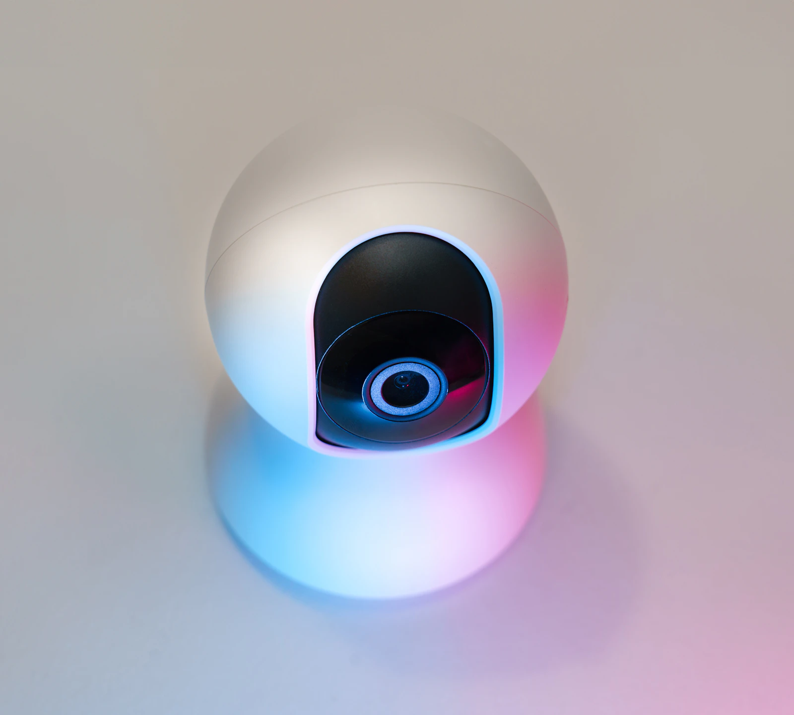 Compact smart home security camera on a table