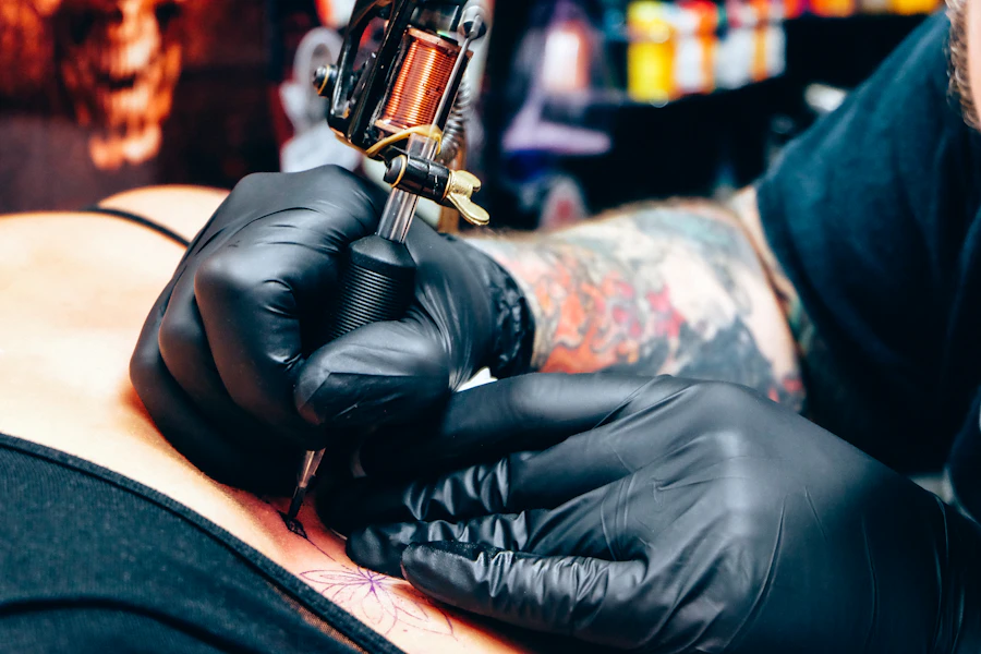 A tattooed artist in the studio.