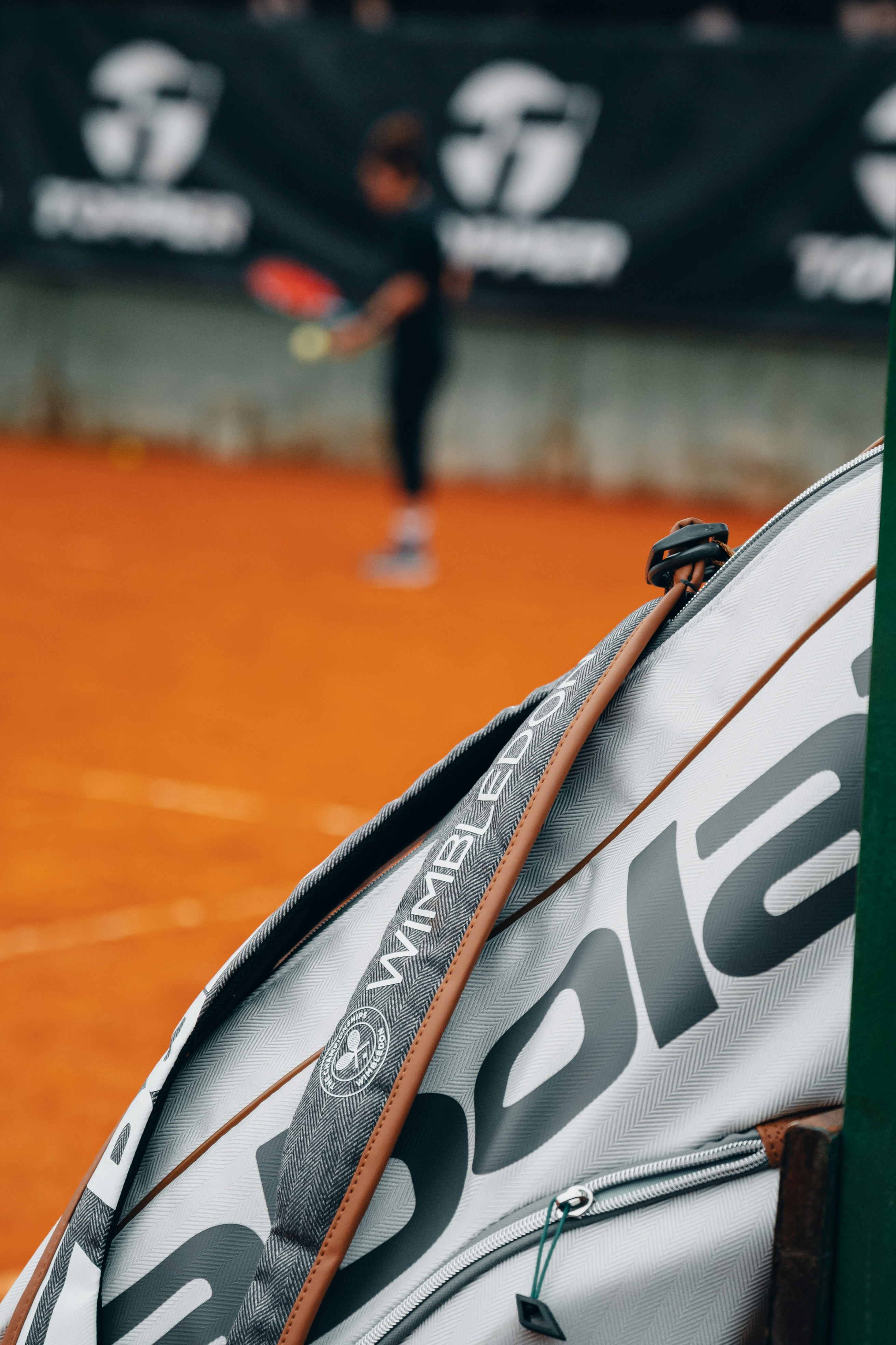 A tennis racket leaning against a racket holder