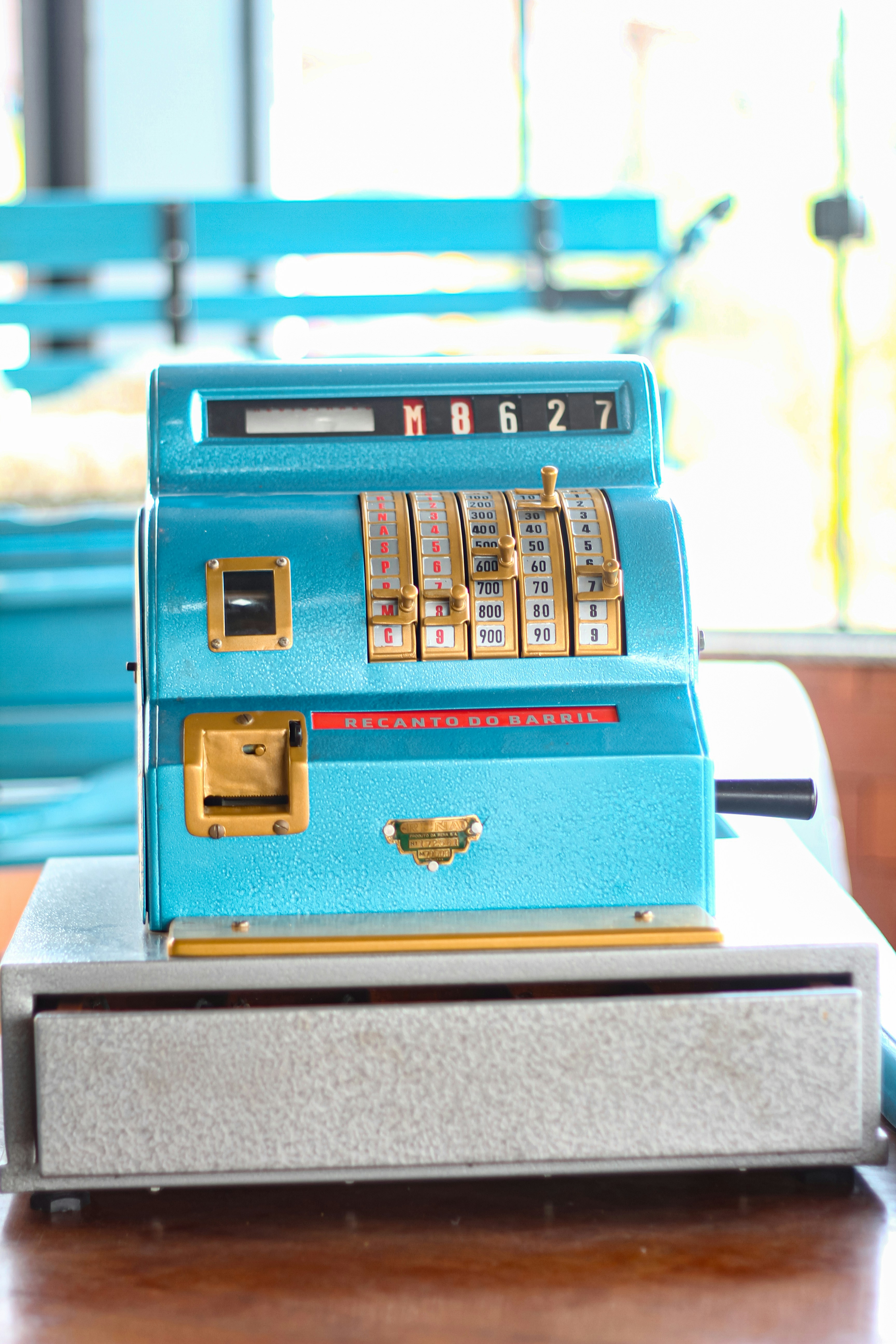 A blue machine sitting on top of a wooden table